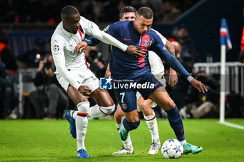 2023-10-25 - Pierre KALULU of AC Milan and Kylian MBAPPE of PSG during the UEFA Champions League, Group F football match between Paris Saint-Germain and AC Milan on October 25, 2023 at Parc des Princes stadium in Paris, France - FOOTBALL - CHAMPIONS LEAGUE - PARIS SG V MILAN - UEFA CHAMPIONS LEAGUE - SOCCER