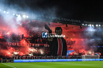 2023-10-25 - PSG supporters deploy a giant tifo representing French actor Jean-Paul BELMONDO and use smoke bombs during the UEFA Champions League, Group F football match between Paris Saint-Germain and AC Milan on October 25, 2023 at Parc des Princes stadium in Paris, France - FOOTBALL - CHAMPIONS LEAGUE - PARIS SG V MILAN - UEFA CHAMPIONS LEAGUE - SOCCER