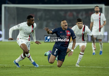 2023-10-25 - Kylian Mbappe of PSG, left Pierre Kalulu of AC Milan during the UEFA Champions League, Group F football match between Paris Saint-Germain and AC Milan on October 25, 2023 at Parc des Princes stadium in Paris, France - FOOTBALL - CHAMPIONS LEAGUE - PARIS SG V MILAN - UEFA CHAMPIONS LEAGUE - SOCCER