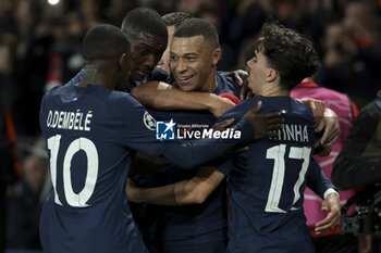 2023-10-25 - Kylian Mbappe of PSG celebrates his goal with Randal Kolo Muani, Vitinha of PSG during the UEFA Champions League, Group F football match between Paris Saint-Germain and AC Milan on October 25, 2023 at Parc des Princes stadium in Paris, France - FOOTBALL - CHAMPIONS LEAGUE - PARIS SG V MILAN - UEFA CHAMPIONS LEAGUE - SOCCER