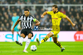 2023-10-25 - Jamaal Lascelles of Newcastle and Niclas Fullkrug of Borussia Dortmund during the UEFA Champions League, Group F football match between Newcastle United and Borussia Dortmund on 25 October 2023 at St. James' Park in Newcastle, England - FOOTBALL - CHAMPIONS LEAGUE - NEWCASTLE V DORTMUND - UEFA CHAMPIONS LEAGUE - SOCCER