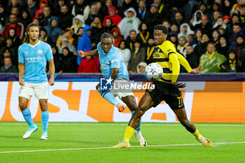2023-10-26 - Jeremy Doku (11) of Manchester City and Joel Monteiro of Young Boys during the UEFA Champions League, Group G football match between BSC Young Boys and Manchester City on 25 October 2023 at Stade de Suisse in Bern, Switzerland - FOOTBALL - CHAMPIONS LEAGUE - YOUNG BOYS V MANCHESTER CITY - UEFA CHAMPIONS LEAGUE - SOCCER