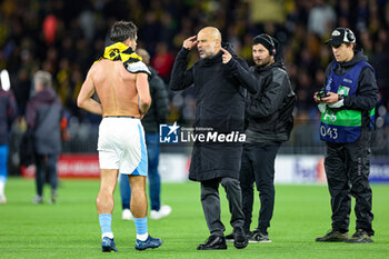 2023-10-26 - Pep Guardiola Manager of Manchester City gestures to Jack Grealish (10) of Manchester City at full time during the UEFA Champions League, Group G football match between BSC Young Boys and Manchester City on 25 October 2023 at Stade de Suisse in Bern, Switzerland - FOOTBALL - CHAMPIONS LEAGUE - YOUNG BOYS V MANCHESTER CITY - UEFA CHAMPIONS LEAGUE - SOCCER