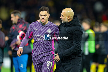 2023-10-26 - Pep Guardiola Manager of Manchester City congratulates Ederson (31) of Manchester City at full time during the UEFA Champions League, Group G football match between BSC Young Boys and Manchester City on 25 October 2023 at Stade de Suisse in Bern, Switzerland - FOOTBALL - CHAMPIONS LEAGUE - YOUNG BOYS V MANCHESTER CITY - UEFA CHAMPIONS LEAGUE - SOCCER