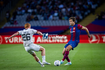 2023-10-25 - Marcos Alonso of FC Barcelona and Yukhym Konoplya of Shakhtar Donetsk during the UEFA Champions League, Group H football match between FC Barcelona and Shakhtar Donetsk on October 25, 2023 at Estadio Olimpico de Montjuic in Barcelona, Spain - FOOTBALL - CHAMPIONS LEAGUE - FC BARCELONA V SHAKHTAR DONETSK - UEFA CHAMPIONS LEAGUE - SOCCER