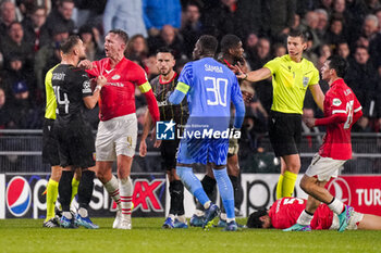2023-11-08 - Jonathan Gradit of RC Lens pulling the shirt of Luuk de Jong of PSV during the UEFA Champions League, Group B football match between PSV and RC Lens on November 8, 2023 at Philips Stadion in Eindhoven, Netherlands - FOOTBALL - CHAMPIONS LEAGUE - PSV V LENS - UEFA CHAMPIONS LEAGUE - SOCCER