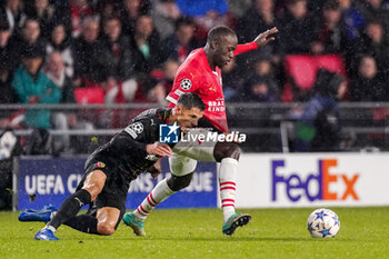 2023-11-08 - Jordan Teze of PSV and Florian Sotoca of RC Lens during the UEFA Champions League, Group B football match between PSV and RC Lens on November 8, 2023 at Philips Stadion in Eindhoven, Netherlands - FOOTBALL - CHAMPIONS LEAGUE - PSV V LENS - UEFA CHAMPIONS LEAGUE - SOCCER