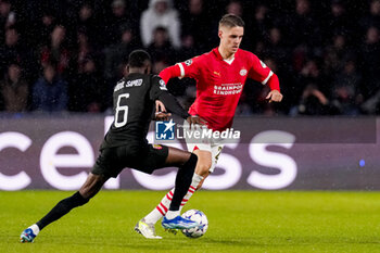 2023-11-08 - Joey Veerman of PSV and Salis Abdul Samed of RC Lens during the UEFA Champions League, Group B football match between PSV and RC Lens on November 8, 2023 at Philips Stadion in Eindhoven, Netherlands - FOOTBALL - CHAMPIONS LEAGUE - PSV V LENS - UEFA CHAMPIONS LEAGUE - SOCCER