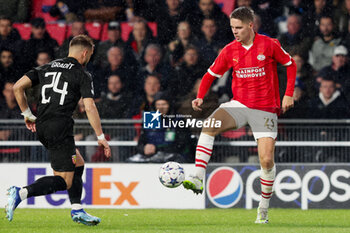 2023-11-08 - Joey Veerman of PSV and Jonathan Gradit of RC Lens during the UEFA Champions League, Group B football match between PSV and RC Lens on November 8, 2023 at Philips Stadion in Eindhoven, Netherlands - FOOTBALL - CHAMPIONS LEAGUE - PSV V LENS - UEFA CHAMPIONS LEAGUE - SOCCER