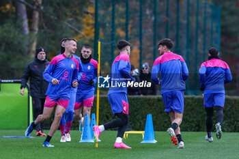 2023-11-27 - Francesco Camarda of AC Milan  warms up with his teammates during the AC Milan training session at Milanello Sports Center ahead of their UEFA Champions League 2023/24 Group Stage F match against Borussia Dortmund at Centro Sportivo Milanello, Carnago, Italy on November 27, 2023 - AC MILAN TRAINING - UEFA CHAMPIONS LEAGUE - SOCCER