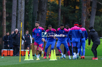 2023-11-27 - Olivier Giroud of AC Milan  warms up with his teammates during the AC Milan training session at Milanello Sports Center ahead of their UEFA Champions League 2023/24 Group Stage F match against Borussia Dortmund at Centro Sportivo Milanello, Carnago, Italy on November 27, 2023 - AC MILAN TRAINING - UEFA CHAMPIONS LEAGUE - SOCCER