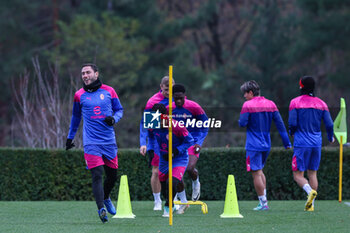 2023-11-27 - Davide Calabria of AC Milan (L)  warms up with his teammates during the AC Milan training session at Milanello Sports Center ahead of their UEFA Champions League 2023/24 Group Stage F match against Borussia Dortmund at Centro Sportivo Milanello, Carnago, Italy on November 27, 2023 - AC MILAN TRAINING - UEFA CHAMPIONS LEAGUE - SOCCER