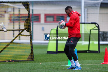 2023-11-27 - Mike Maignan of AC Milan warms up during the AC Milan training session at Milanello Sports Center ahead of their UEFA Champions League 2023/24 Group Stage F match against Borussia Dortmund at Centro Sportivo Milanello, Carnago, Italy on November 27, 2023 - AC MILAN TRAINING - UEFA CHAMPIONS LEAGUE - SOCCER
