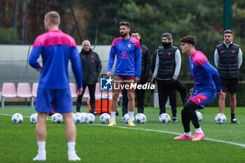 2023-11-27 - Olivier Giroud of AC Milan warms up with his teammates during the AC Milan training session at Milanello Sports Center ahead of their UEFA Champions League 2023/24 Group Stage F match against Borussia Dortmund at Centro Sportivo Milanello, Carnago, Italy on November 27, 2023 - AC MILAN TRAINING - UEFA CHAMPIONS LEAGUE - SOCCER