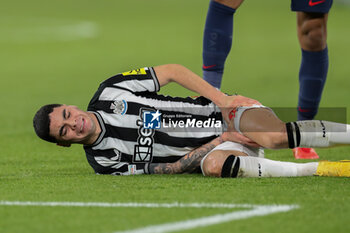 2023-11-28 - Newcastle United midfielder Miguel Almiron (24) lays on pitch injured during the UEFA Champions League, Group F football match between Paris Saint-Germain and Newcastle United on November 28, 2023 at Parc des Princes stadium in Paris, France - FOOTBALL - CHAMPIONS LEAGUE - PARIS SG V NEWCASTLE - UEFA CHAMPIONS LEAGUE - SOCCER