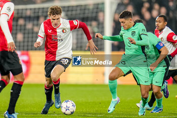 2023-11-28 - Mats Wieffer of Feyenoord is challenged by Nahuel Molina of Atletico Madrid during the UEFA Champions League, Group E football match between Feyenoord and Atletico Madrid on November 28, 2023 at Stadion Feijenoord "De Kuip" in Rotterdam, Netherlands - FOOTBALL - CHAMPIONS LEAGUE - FEYENOORD V ATLETICO MADRID - UEFA CHAMPIONS LEAGUE - SOCCER