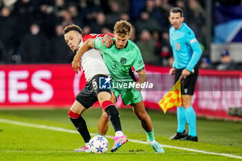2023-11-28 - Quilindschy Hartman of Feyenoord battles for the ball with Marcos Llorente of Atletico Madrid during the UEFA Champions League, Group E football match between Feyenoord and Atletico Madrid on November 28, 2023 at Stadion Feijenoord "De Kuip" in Rotterdam, Netherlands - FOOTBALL - CHAMPIONS LEAGUE - FEYENOORD V ATLETICO MADRID - UEFA CHAMPIONS LEAGUE - SOCCER