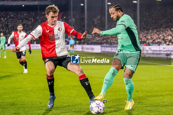 2023-11-28 - Memphis Depay of Atletico Madrid is challenged by Mats Wieffer of Feyenoord during the UEFA Champions League, Group E football match between Feyenoord and Atletico Madrid on November 28, 2023 at Stadion Feijenoord "De Kuip" in Rotterdam, Netherlands - FOOTBALL - CHAMPIONS LEAGUE - FEYENOORD V ATLETICO MADRID - UEFA CHAMPIONS LEAGUE - SOCCER