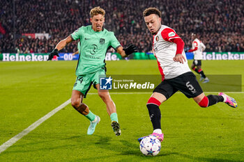 2023-11-28 - Marcos Llorente of Atletico Madrid battles for possession with Quilindschy Hartman of Feyenoord during the UEFA Champions League, Group E football match between Feyenoord and Atletico Madrid on November 28, 2023 at Stadion Feijenoord "De Kuip" in Rotterdam, Netherlands - FOOTBALL - CHAMPIONS LEAGUE - FEYENOORD V ATLETICO MADRID - UEFA CHAMPIONS LEAGUE - SOCCER