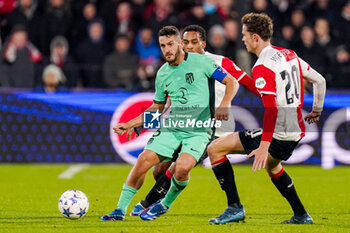 2023-11-28 - Koke of Atletico Madrid battles for possession with Quinten Timber and Mats Wieffer of Feyenoord during the UEFA Champions League, Group E football match between Feyenoord and Atletico Madrid on November 28, 2023 at Stadion Feijenoord "De Kuip" in Rotterdam, Netherlands - FOOTBALL - CHAMPIONS LEAGUE - FEYENOORD V ATLETICO MADRID - UEFA CHAMPIONS LEAGUE - SOCCER