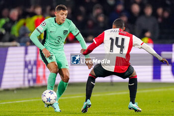 2023-11-28 - Nahuel Molina of Atletico Madrid battles for possession with Igor Paixao of Feyenoord during the UEFA Champions League, Group E football match between Feyenoord and Atletico Madrid on November 28, 2023 at Stadion Feijenoord "De Kuip" in Rotterdam, Netherlands - FOOTBALL - CHAMPIONS LEAGUE - FEYENOORD V ATLETICO MADRID - UEFA CHAMPIONS LEAGUE - SOCCER
