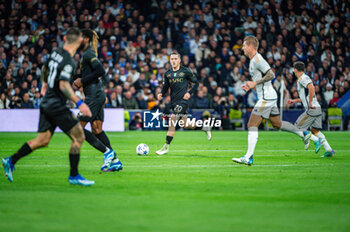 2023-11-29 - Piotr Zielinski of Napoli seen in action with the ball during the Champions League football match between Real Madrid and Napoli at Bernabeu Stadium in Madrid, Spain. - REAL MADRID VS NAPOLI - UEFA CHAMPIONS LEAGUE - SOCCER