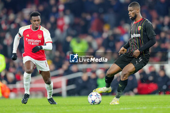 2023-11-29 - Lens defender Kevin Danso (4) and Eddie Nketiah of Arsenal during the UEFA Champions League, Group B football match between Arsenal and RC Lens on 29 November 2023 at the Emirates Stadium in London, England - FOOTBALL - CHAMPIONS LEAGUE - ARSENAL V LENS - UEFA CHAMPIONS LEAGUE - SOCCER