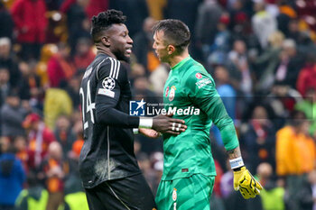 2023-11-29 - Andre Onana of Manchester United and Fernando Muslera of Galatasaray at full time during the UEFA Champions League, Group A football match between Galatasaray and Manchester United on November 29, 2023 at the Ali Sami Yen Arena in Istanbul, Turkey - FOOTBALL - CHAMPIONS LEAGUE - GALATASARAY V MANCHESTER UNITED - UEFA CHAMPIONS LEAGUE - SOCCER