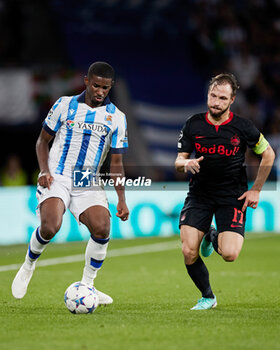 2023-11-29 - Mohamed-Ali Cho of Real Sociedad competes for the ball with Andreas Ulmer of FC Red Bull Salzburg during the UEFA Champions League, Group D football match between Real Sociedad and FC Red Bull Salzburg on November 29, 2023 at Reale Arena in San Sebastian, Spain - FOOTBALL - CHAMPIONS LEAGUE - REAL SOCIEDAD V RB SALZBURG - UEFA CHAMPIONS LEAGUE - SOCCER