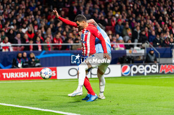 2023-12-13 - Angel Correa of Atletico Madrid seen in action against Elseid Hysaj of Lazio during the Champions League football match between Atletico Madrid and Lazio at Metropolitano Stadium in Madrid, Spain. - ATLETICO MADRID VS SS LAZIO - UEFA CHAMPIONS LEAGUE - SOCCER