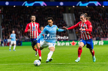 2023-12-13 - Felipe Anderson of Lazio seen in action against Mario Hermoso and Caglar Soyuncu of Atletico Madrid during the Champions League football match between Atletico Madrid and Lazio at Metropolitano Stadium in Madrid, Spain. - ATLETICO MADRID VS SS LAZIO - UEFA CHAMPIONS LEAGUE - SOCCER