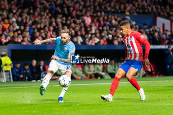 2023-12-13 - Manuel Lazzari of Lazio seen in action against Samuel Lino of Atletico Madrid during the Champions League football match between Atletico Madrid and Lazio at Metropolitano Stadium in Madrid, Spain. - ATLETICO MADRID VS SS LAZIO - UEFA CHAMPIONS LEAGUE - SOCCER
