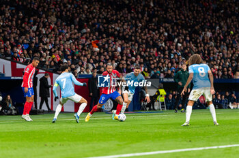 2023-12-13 - Memphis Depay of Atletico Madrid seen in action against Matias Vecino of Lazio during the Champions League football match between Atletico Madrid and Lazio at Metropolitano Stadium in Madrid, Spain. - ATLETICO MADRID VS SS LAZIO - UEFA CHAMPIONS LEAGUE - SOCCER