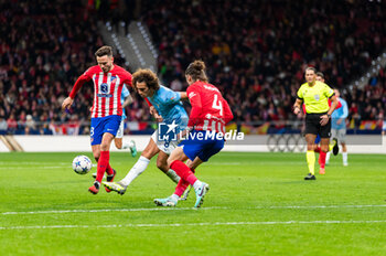 2023-12-13 - Matteo Guendouzi of Lazio seen in action against Saul Niguez and Caglar Soyuncu of Atletico Madrid during during the Champions League football match between Atletico Madrid and Lazio at Metropolitano Stadium in Madrid, Spain. - ATLETICO MADRID VS SS LAZIO - UEFA CHAMPIONS LEAGUE - SOCCER