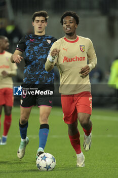 2023-12-12 - Elye Wahi of Lens, left Juanlu Sanchez of Sevilla FC during the UEFA Champions League, Group B football match between RC Lens and Sevilla FC on December 12, 2023 at Bollaert-Delelis stadium in Lens, France - FOOTBALL - CHAMPIONS LEAGUE - LENS V SEVILLA - UEFA CHAMPIONS LEAGUE - SOCCER