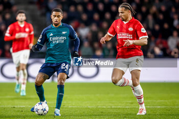 2023-12-12 - Reiss Nelson of Arsenal and Armando Obispo of PSV during the UEFA Champions League, Group B football match between PSV and Arsenal on December 12, 2023 at the Phillips Stadion in Eindhoven, Netherlands - FOOTBALL - CHAMPIONS LEAGUE - PSV V ARSENAL - UEFA CHAMPIONS LEAGUE - SOCCER