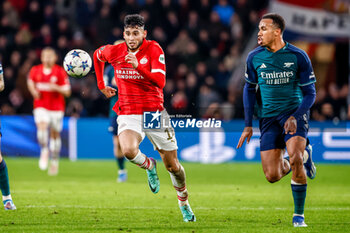 2023-12-12 - Ricardo Pepi of PSV battles for the ball with Gabriel of Arsenal during the UEFA Champions League, Group B football match between PSV and Arsenal on December 12, 2023 at the Phillips Stadion in Eindhoven, Netherlands - FOOTBALL - CHAMPIONS LEAGUE - PSV V ARSENAL - UEFA CHAMPIONS LEAGUE - SOCCER