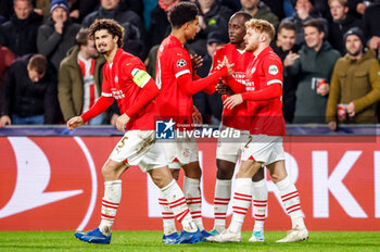 2023-12-12 - Yorbe Vertessen of PSV celebrates his goal 1-1 with Malik Tillman and Jordan Teze during the UEFA Champions League, Group B football match between PSV and Arsenal on December 12, 2023 at the Phillips Stadion in Eindhoven, Netherlands - FOOTBALL - CHAMPIONS LEAGUE - PSV V ARSENAL - UEFA CHAMPIONS LEAGUE - SOCCER