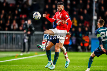 2023-12-12 - Ricardo Pepi of PSV is challenged by William Saliba of Arsenal during the UEFA Champions League, Group B football match between PSV and Arsenal on December 12, 2023 at the Phillips Stadion in Eindhoven, Netherlands - FOOTBALL - CHAMPIONS LEAGUE - PSV V ARSENAL - UEFA CHAMPIONS LEAGUE - SOCCER