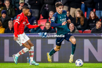 2023-12-12 - Kai Havertz of Arsenal is challenged by Patrick van Aanholt of PSV during the UEFA Champions League, Group B football match between PSV and Arsenal on December 12, 2023 at the Phillips Stadion in Eindhoven, Netherlands - FOOTBALL - CHAMPIONS LEAGUE - PSV V ARSENAL - UEFA CHAMPIONS LEAGUE - SOCCER