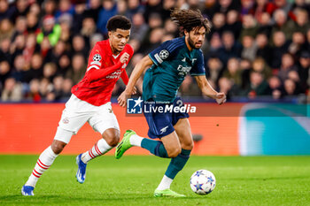 2023-12-12 - Mohamed Elneny of Arsenal and Malik Tillman of PSV during the UEFA Champions League, Group B football match between PSV and Arsenal on December 12, 2023 at the Phillips Stadion in Eindhoven, Netherlands - FOOTBALL - CHAMPIONS LEAGUE - PSV V ARSENAL - UEFA CHAMPIONS LEAGUE - SOCCER