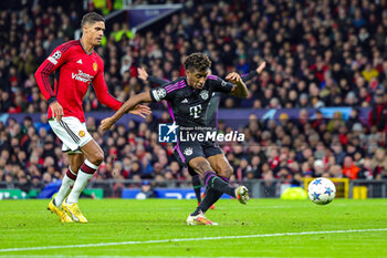 2023-12-13 - Kingsley Coman (11) of Bayern Munich scores a goal 0-1, Raphael Varane of Manchester United during the UEFA Champions League, Group A football match between Manchester United and Bayern Munich on 12 December 2023 at Old Trafford in Manchester, England - FOOTBALL - CHAMPIONS LEAGUE - MANCHESTER UNITED V BAYERN MUNICH - UEFA CHAMPIONS LEAGUE - SOCCER
