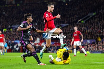 2023-12-13 - Kingsley Coman (11) of Bayern Munich and Diogo Dalot, Andre Onana of Manchester United during the UEFA Champions League, Group A football match between Manchester United and Bayern Munich on 12 December 2023 at Old Trafford in Manchester, England - FOOTBALL - CHAMPIONS LEAGUE - MANCHESTER UNITED V BAYERN MUNICH - UEFA CHAMPIONS LEAGUE - SOCCER