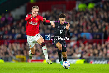 2023-12-13 - Scott McTominay (39) of Manchester United tussles with Jamal Musiala (42) of Bayern Munich during the UEFA Champions League, Group A football match between Manchester United and Bayern Munich on 12 December 2023 at Old Trafford in Manchester, England - FOOTBALL - CHAMPIONS LEAGUE - MANCHESTER UNITED V BAYERN MUNICH - UEFA CHAMPIONS LEAGUE - SOCCER