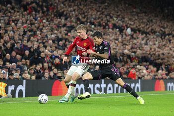 2023-12-13 - Rasmus Hojlund (11) of Manchester United tussles with Kim Min-Jae (3) of Bayern Munich during the UEFA Champions League, Group A football match between Manchester United and Bayern Munich on 12 December 2023 at Old Trafford in Manchester, England - FOOTBALL - CHAMPIONS LEAGUE - MANCHESTER UNITED V BAYERN MUNICH - UEFA CHAMPIONS LEAGUE - SOCCER