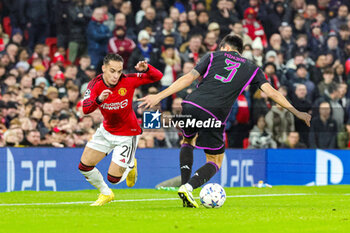 2023-12-13 - Antony (21) of Manchester United goes past Kim Min-Jae (3) of Bayern Munich during the UEFA Champions League, Group A football match between Manchester United and Bayern Munich on 12 December 2023 at Old Trafford in Manchester, England - FOOTBALL - CHAMPIONS LEAGUE - MANCHESTER UNITED V BAYERN MUNICH - UEFA CHAMPIONS LEAGUE - SOCCER