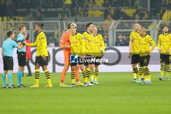 2023-12-13 - Borussia Dortmund players look dejected at full time during the UEFA Champions League, Group F football match between Borussia Dortmund and Paris Saint-Germain on December 13, 2023 at Signal Iduna Park in Dortmund, Germany - FOOTBALL - CHAMPIONS LEAGUE - DORTMUND V PARIS SG - UEFA CHAMPIONS LEAGUE - SOCCER