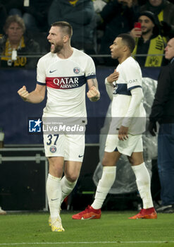 2023-12-13 - Kylian Mbappe of PSG celebrates his goal with Milan Skriniar (left) - a goal later cancelled - during the UEFA Champions League, Group F football match between Borussia Dortmund and Paris Saint-Germain on December 13, 2023 at Signal Iduna Park in Dortmund, Germany - FOOTBALL - CHAMPIONS LEAGUE - DORTMUND V PARIS SG - UEFA CHAMPIONS LEAGUE - SOCCER