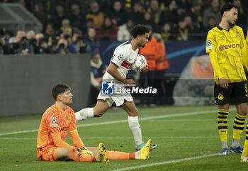 2023-12-13 - Warren Zaire-Emery of PSG celebrates his goal while Goalkeeper of Dortmund Gregor Kobel is dejected during the UEFA Champions League, Group F football match between Borussia Dortmund and Paris Saint-Germain on December 13, 2023 at Signal Iduna Park in Dortmund, Germany - FOOTBALL - CHAMPIONS LEAGUE - DORTMUND V PARIS SG - UEFA CHAMPIONS LEAGUE - SOCCER