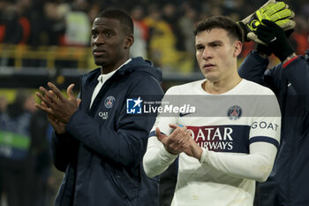 2023-12-13 - Nordi Mukiele, Manuel Ugarte of PSG salute the supporters following the UEFA Champions League, Group F football match between Borussia Dortmund and Paris Saint-Germain on December 13, 2023 at Signal Iduna Park in Dortmund, Germany - FOOTBALL - CHAMPIONS LEAGUE - DORTMUND V PARIS SG - UEFA CHAMPIONS LEAGUE - SOCCER
